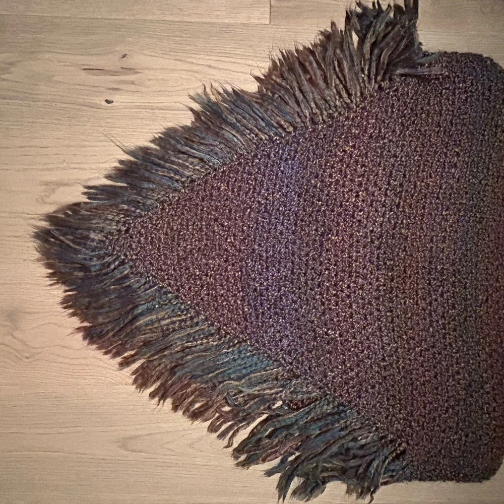 Multicolor Textured poncho with fringe. This is handmade and one size fits all.